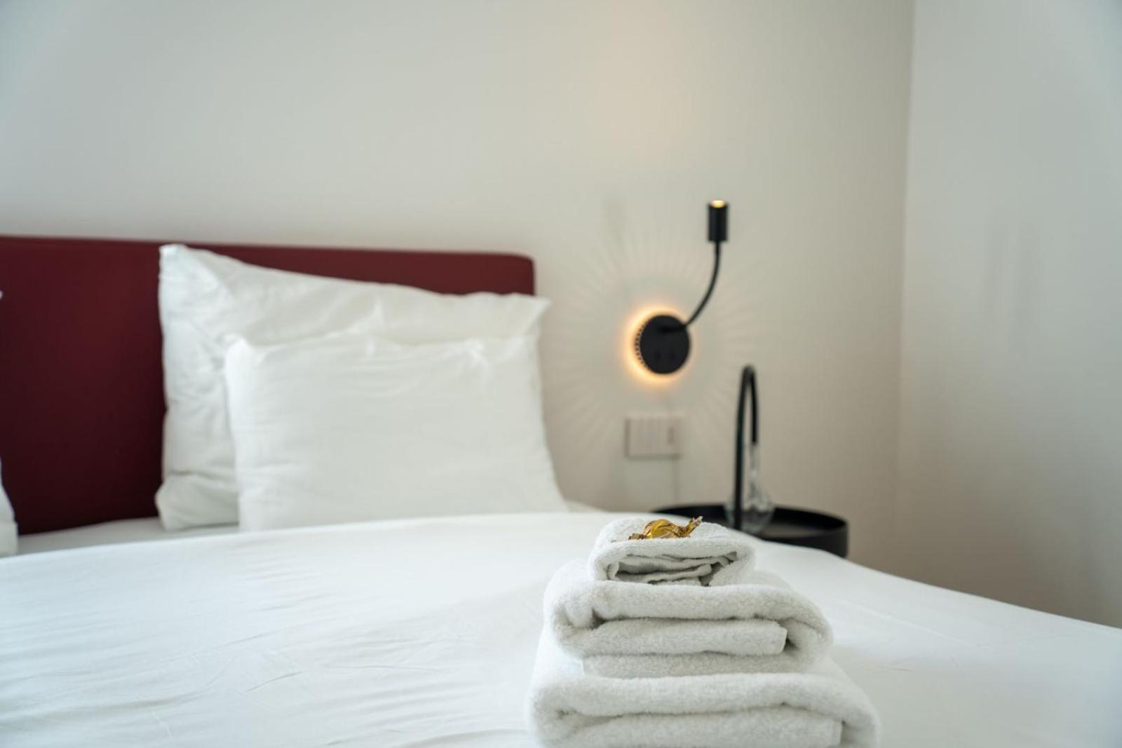 Guesthouse Diwine メラーノ エクステリア 写真 A bed with towels